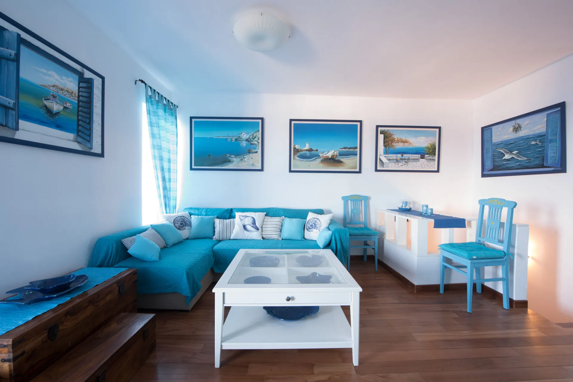 Ermoupolis Panorama Art Villa luxury living room featuring contemporary art paintings and neoclassical interior design in Syros.